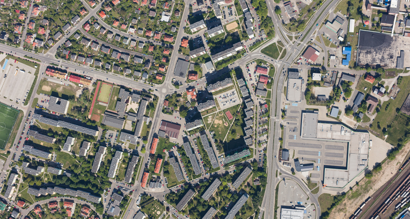 Top-down view of a suburban area with roads, residential buildings, and commercial zones, highlighting the Pegasus TRK Neo’s ability to capture high-definition mapping data for simulations, infrastructure planning, and autonomous driving applications.